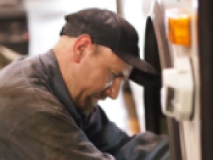 Lorenz mechanic working on a charter bus