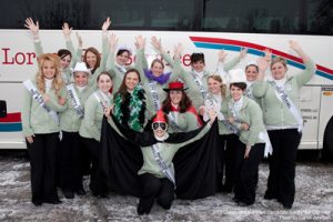 Travel group posing in front of Lorenz charter bus