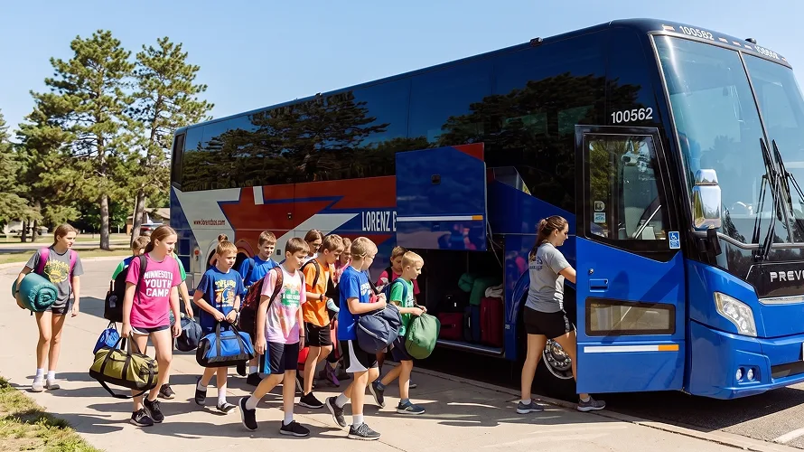 Group of children with bags boarding a Lorenz Bus Service Prevost motorcoach for a Minnesota youth camp charter trip